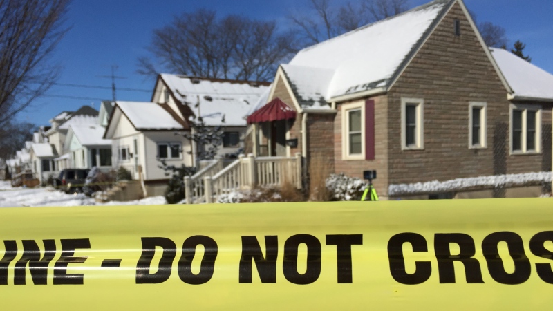 Police investigators work at the scene of a homicide at 566 Devine Street in Sarnia, Ont. on Wednesday, Jan. 27, 2021. (Bryan Bicknell / CTV News)