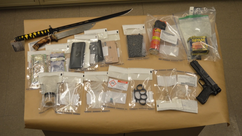 Alberta RCMP found $10,000 in controlled substances, several weapons, and a can of SPAM in the vehicle of two accused drug traffickers on Jan. 20, 2021. (Photo: RCMP)