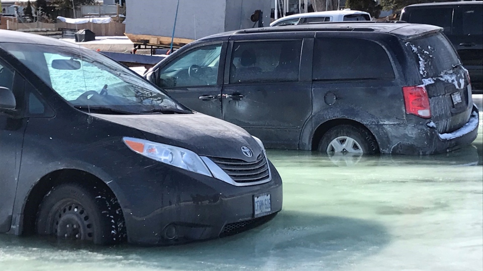 Minivans through ice on Cook's Bay