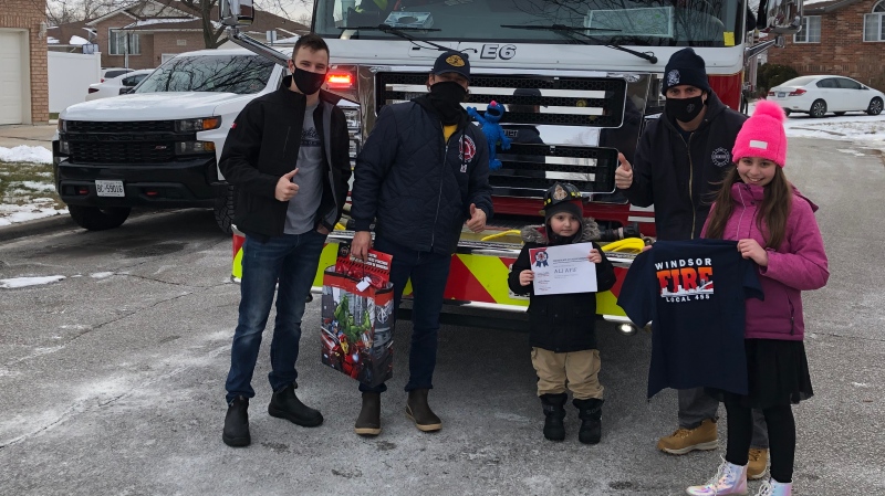 Four year-old Ali Afif presented with a t-shirt and certificate from the Windsor Fire and Rescue Service in Windsor, Ont. on Saturday, Jan. 30, 2021. (Alana Hadadean/CTV Windsor)