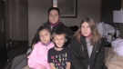 Sherry Lynn Abbey (back) with her three kids in a St. Thomas motel room on Jan. 31, 2021. (Brent Lale/CTV London)