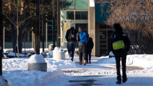 High school students arrive for school in Ottawa as in-person classes resume in the region for the first time since the winter holidays, on Monday, Feb. 1, 2021, in the midst of the COVID-19 pandemic. (Justin Tang/THE CANADIAN PRESS)