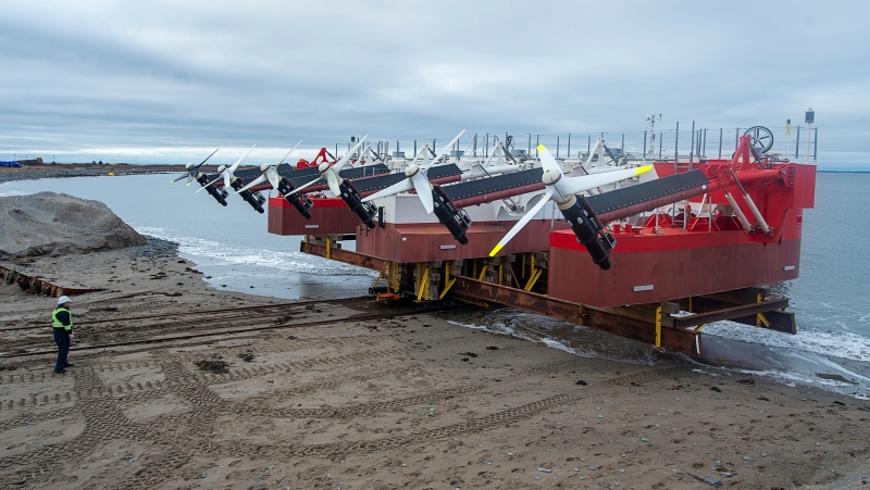 A large floating tidal energy platform with six underwater turbines, the latest high-tech bid to generate electricity by harnessing the Bay of Fundy's powerful tides is launched at A.F. Theriault & Son Ltd. in Meteghan River, N.S. on Monday, Feb. 1, 2021. Sustainable Marine says its Pempa’q In-stream Tidal Energy Project will eventually include two other platforms, which will produce a total of nine megawatts of electricity. (THE CANADIAN PRESS/Andrew Vaughan)