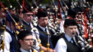 Bagpipers take to the field during the Massed Pipe Bands event at the Glengarry Highland Games in Maxville, Ont., on Saturday, August 1, 2015. The two day event is one of the largest Highland Games in the world and features the North American Pipe Band Championship, Scottish heavyweight sports, highland dancing and the celebration of Scottish culture. (Justin Tang/THE CANADIAN PRESS)
