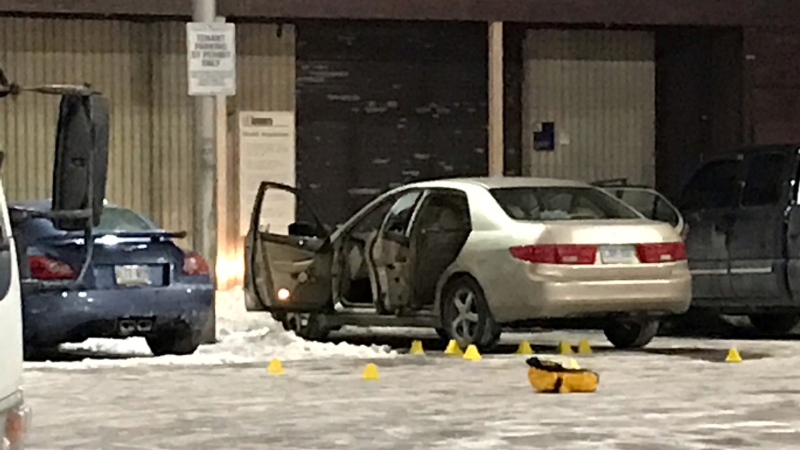 A Honda Accord sedan and numerous evidence markers are seen in a Regent Park-area parking lot on Feb. 3, 2021. (Mike Nguyen/CP24)