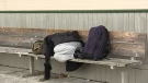 An individual sleeps on a bench outdoor in Simcoe County. (CTV NEWS/FILE IMAGE)