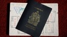 A Canadian passport is displayed in Ottawa on Thursday, July 23, 2015. (THE CANADIAN PRESS / Sean Kilpatrick)