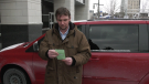Matthew Steeves looks at his $880 ticket in Leamington, Ont., on Friday, Feb. 5, 2021. (Stefanie Masotti / CTV Windsor)