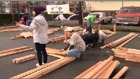 Volunteers construct plant beds for a new community garden in Vancouver's Downtown Eastside. Oct. 31, 2009.