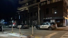 Toronto police investigate a fatal shooting at a parking garage near Danforth and Oak Park avenues Tuesday February 9, 2021. (Mike Nguyen /CP24) 