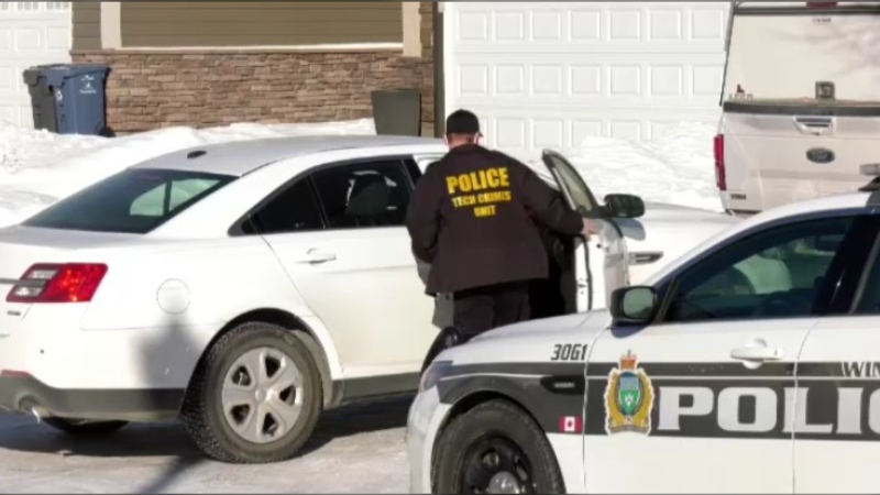 Members of the Winnipeg police conduct investigations and seizures in Winnipeg on Feb. 10, 2021. (CTV News Photo Ken Gabel)