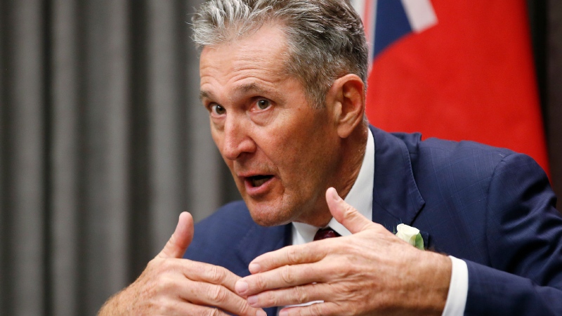 Manitoba premier Brian Pallister speaks to media prior to the reading of the Speech from the Throne at the Manitoba Legislature in Winnipeg, Wednesday, October 7, 2020. THE CANADIAN PRESS/John Woods