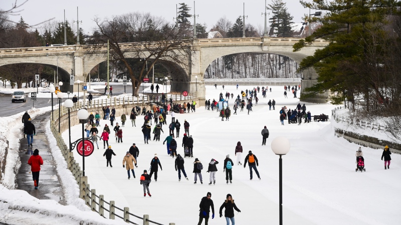 Skaters make their way along the Rideau Canal in Ottawa, Monday, Feb. 15, 2021, during the Family Day long weekend. (Sean Kilpatrick/THE CANADIAN PRESS)