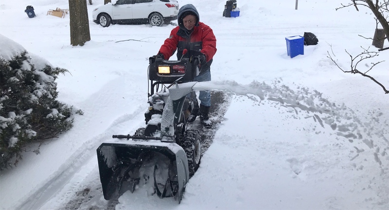 Al Smith clears a neighbour's driveway in London, Ont. on Tuesday, Feb. 16, 2021. (Sean Irvine / CTV News)