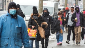 People make their way along St. Catherine street, Monday, February 15, 2021 in Montreal.THE CANADIAN PRESS/Ryan Remiorz