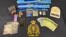 A 45-year-old man from Moncton, N.B. is facing charges after police seized drugs, cigarettes and cash from a residence in Greater Lakeburn, N.B. on Tuesday. (Photo via New Brunswick RCMP)
