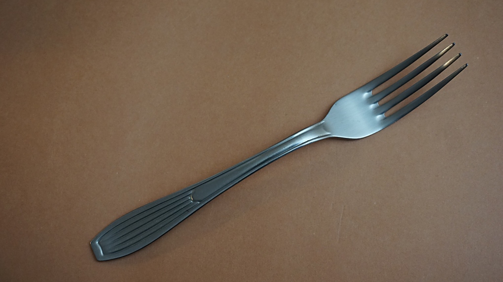 A metal fork on a table
