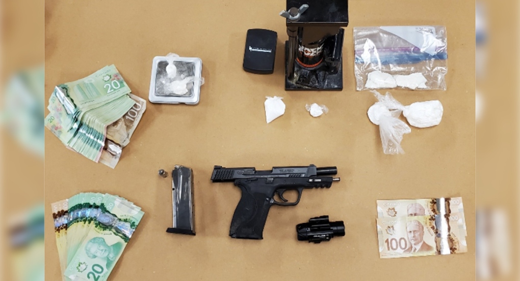 Stolen handgun, drugs and cash
