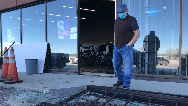 Tony Gallace surveys the damage outside his sporting goods store after it was broken into for a fifth time. (Matt Marshall/CTV News Edmonton)