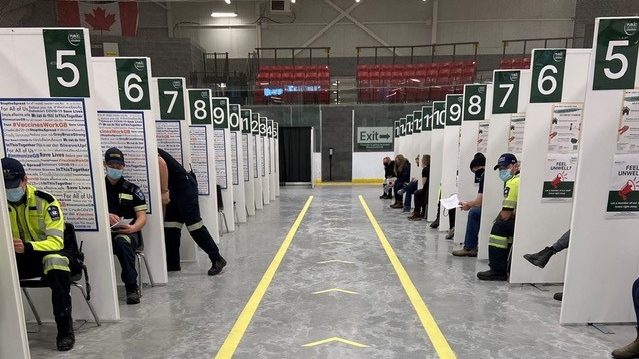 Paramedics from Grey-Bruce get their COVID-19 vaccines at the 'Hockey Hub' vaccination centre in Hanover, Ont. in Feb. 2021. (Source: Bruce County)