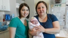 Inuit midwives Cas Augaarjuk Connelly (left) and Rachel Qiliqti Kaludjak pose after a birth at Rankin Inlet's birthing centre in 2012. (THE CANADIAN PRESS/HO-Rachel Qiliqti Kaludjak and Cas Augaarjuk Connelly)