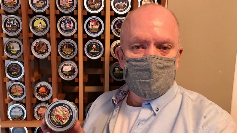David Lewis, a London, Ont. veteran who started his own candle company stands with some of his products on Monday, March 1, 2021. (Sean Irvine / CTV News)