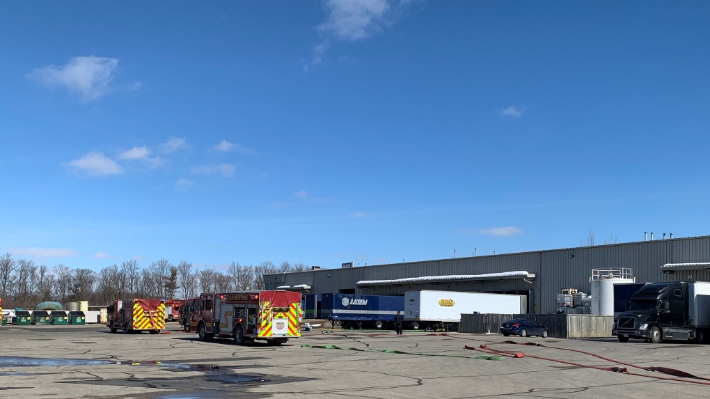 Fire trucks in an industrial parking lot