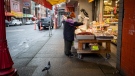 An elderly woman wearing a face mask to curb the spread of COVID-19 shops for dried goods at a store in Chinatown, in Vancouver, on Wednesday, January 27, 2021. THE CANADIAN PRESS/Darryl Dyck