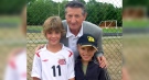 Walter Gretzky poses with fans at a soccer tournament in Brantford, Ont. Lori Lewis McNichol says Gretzky was a gentelman, generous with both her sons, signing a program and a trophy. (Source: Lori Lewis McNichol / Facebook)