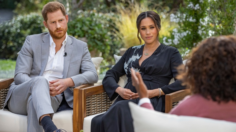 This image provided by Harpo Productions shows Prince Harry, from left, and Meghan, Duchess of Sussex, in conversation with Oprah Winfrey. “Oprah with Meghan and Harry: A CBS Primetime Special” airs March 7. (Joe Pugliese/Harpo Productions via AP)