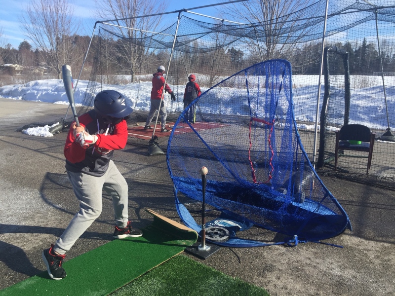 Members of the Central Ontario Reds brave the cold for outdoor practice on Sat. March 6, 2021 in New Lowell, Ont. (Steve Mansbridge/CTV News)