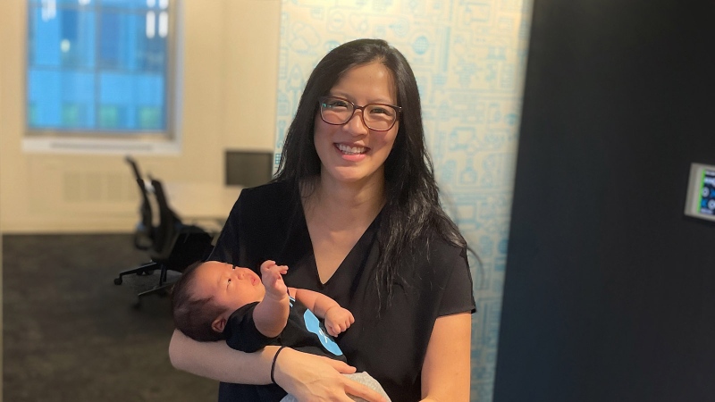 Faye Pang holds her son Kai in Xero's Toronto office. (Submitted)