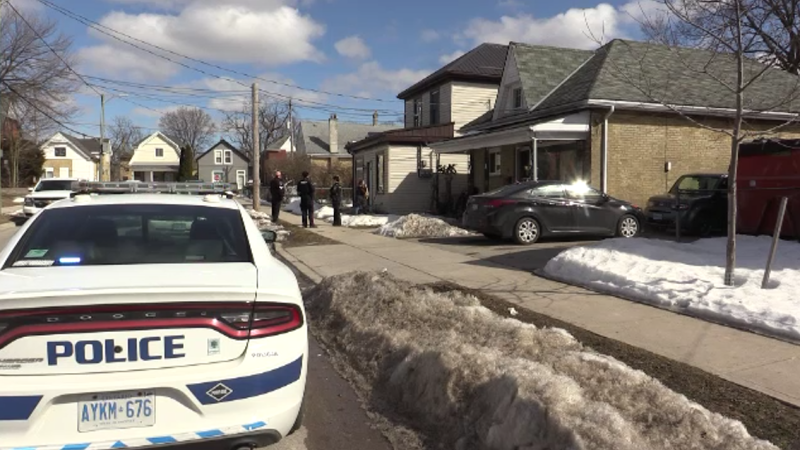 Police work at the scene of a death investigation in London, Ont. on Sunday, March 7, 2021. (Brent Lale / CTV News)