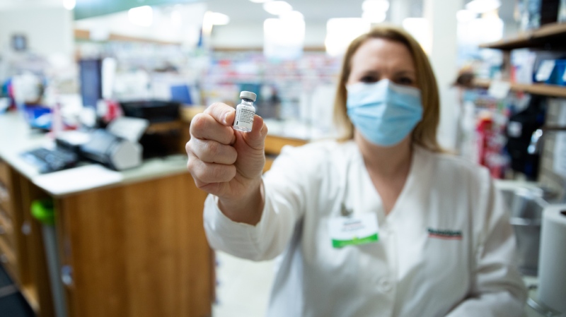 Pharmacist Lisa Woodill displays a vial of COVID-19 vaccine. (Photo via Communications Nova Scotia)