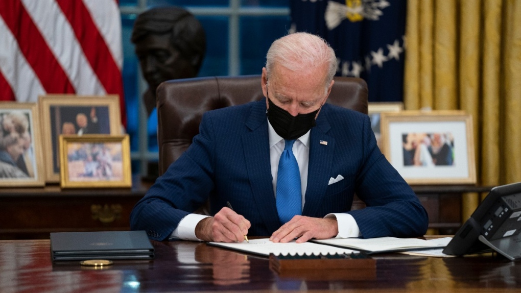 U.S. President Joe Biden signs an executive order