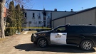 An opp cruiser guards a fatal fire scene in West Lorne, Ont. on Friday, March 12, 2021. (Sean Irvine / CTV News)