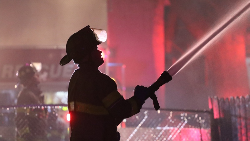 Windsor Fire and Rescue Service crews battled an upgraded house fire on Janette Avenue in Windsor, Ont. on Friday, March 12, 2021. (courtesy OnLocation)