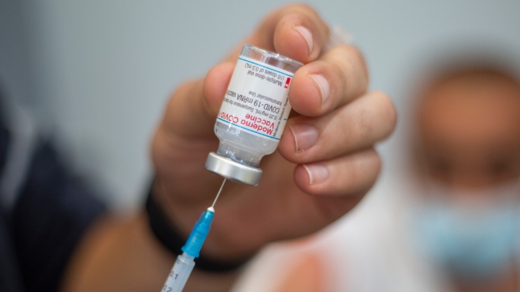 Preparing a dose of Moderna COVID-19 vaccine