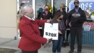 Jean Henderson presenting cheque to SCPA. Tuesday March 16, 2021 (CTV News Edmonton)