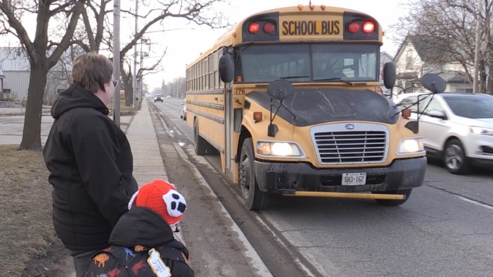 SUV passes school bus