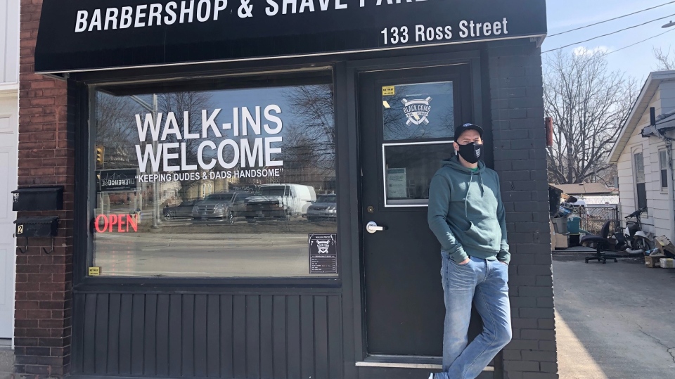 Black Comb Barbershop owner Greg Dennis 