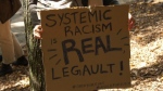 Legault systemic racism sign
