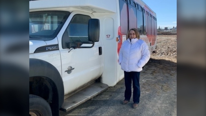 President of the Windsor Senior Citizen Bus Society, Leslie Porter, stands next to one of the Society's buses. The bus, normally used to transport seniors in the community, had its catalytic converter stolen by thieves. (CTV ATLANTIC / HEIDI PETRACEK)