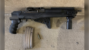 A loaded Ruger Mini-14, .223 rifle with a folding stock and a high-capacity magazine was recently seized by the Winnipeg police. (Image source: Winnipeg Police Service handout)