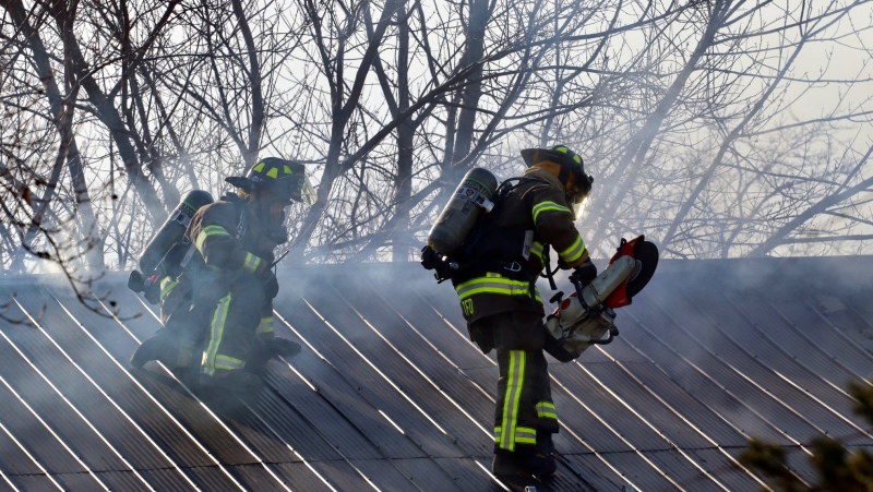 Firefighters battle a house fire in Tecumseh on Monday, March 22, 2021. (Courtesy @_OnLocation_)