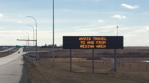 A sign on Highway 11 warns people to avoid travel to and from the Regina area. The Government of Saskatchewan put a travel advisory into effect for Regina and surrounding areas on March 23, 2021. (Katy Syrota/CTV News) 