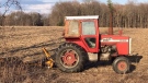 A farm tractor sits upright near where a man was airlifted to hospital near Tillsonburg, Ontario on March 24, 2021. (Sean Irvine CTV News) 
