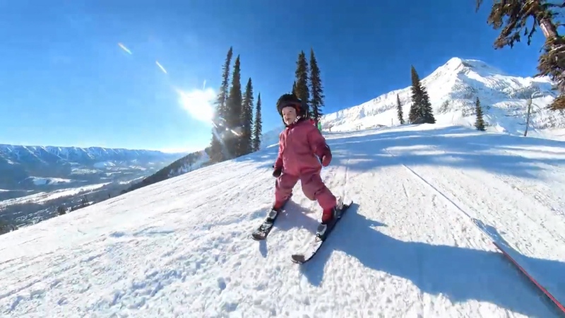 Online videos of two-year-old Adia Leidums show the toddler coaching herself as she skis down the slopes in Fernie, B.C.
