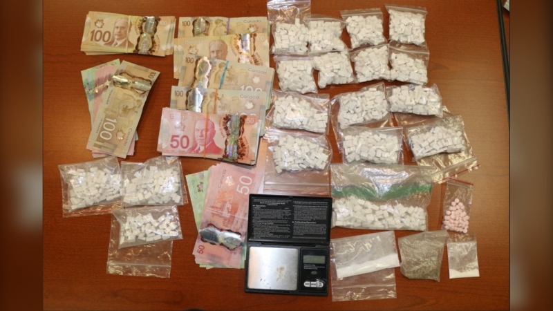 Drugs and cash seized in OPP raid in Cochrane (Supplied)