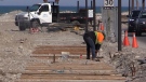 A worker completes repairs to the Goderich Ont. boardwalk on March 30, 2021. (Scott Miller/CTV London)